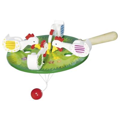 Toy with chickens and a red ball on a white background
