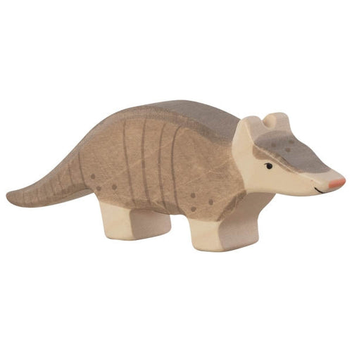 Wooden armadillo toy on a white background